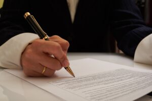 Power of Attorney Lawyer Brandon, FL with a lawyer signing a document